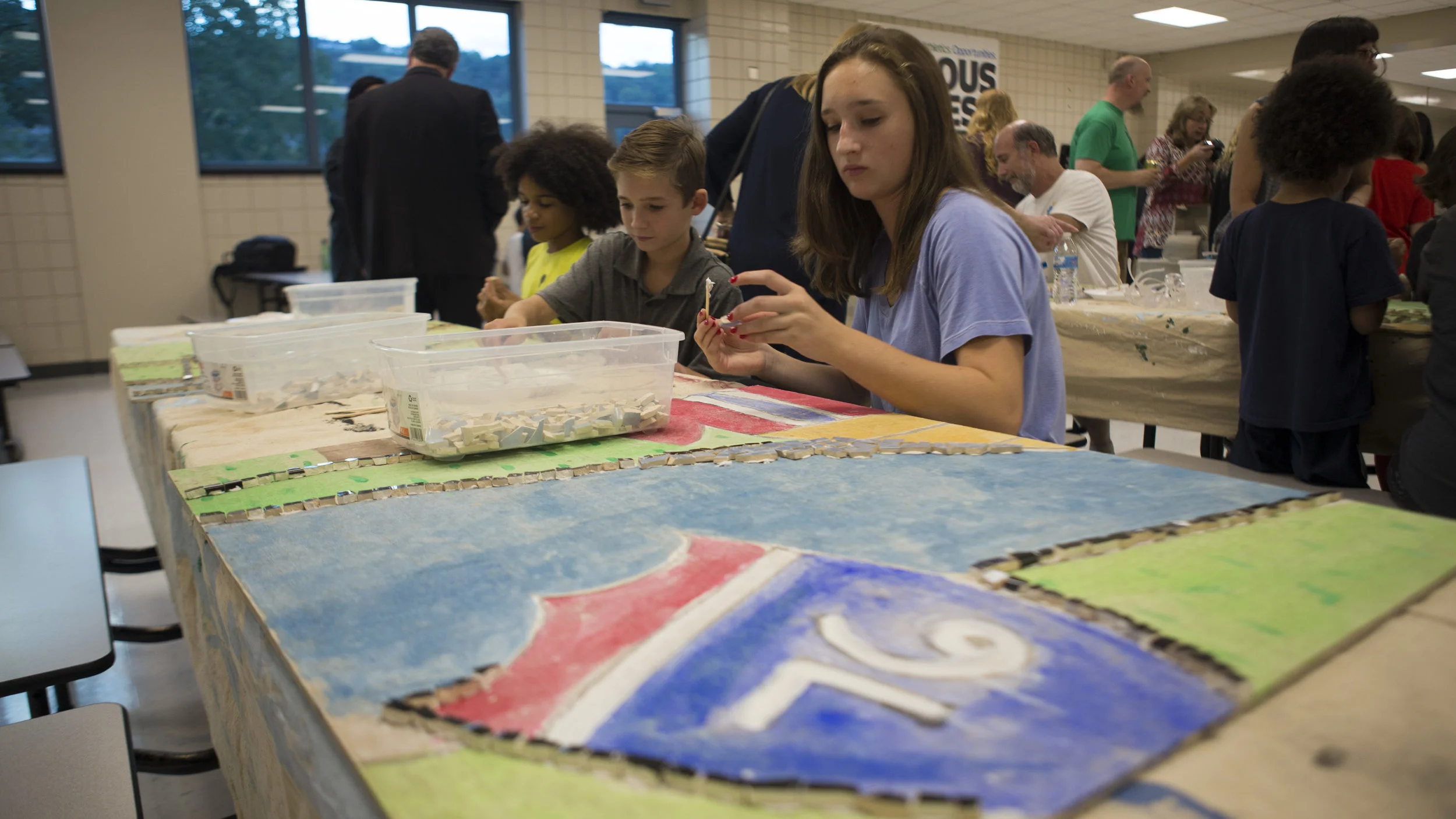 Riverview School District students help to put together a collaborative mosaic as part of an Artist-in-Residence program put on by Pittsburgh Filmmakers/Center for the Arts.