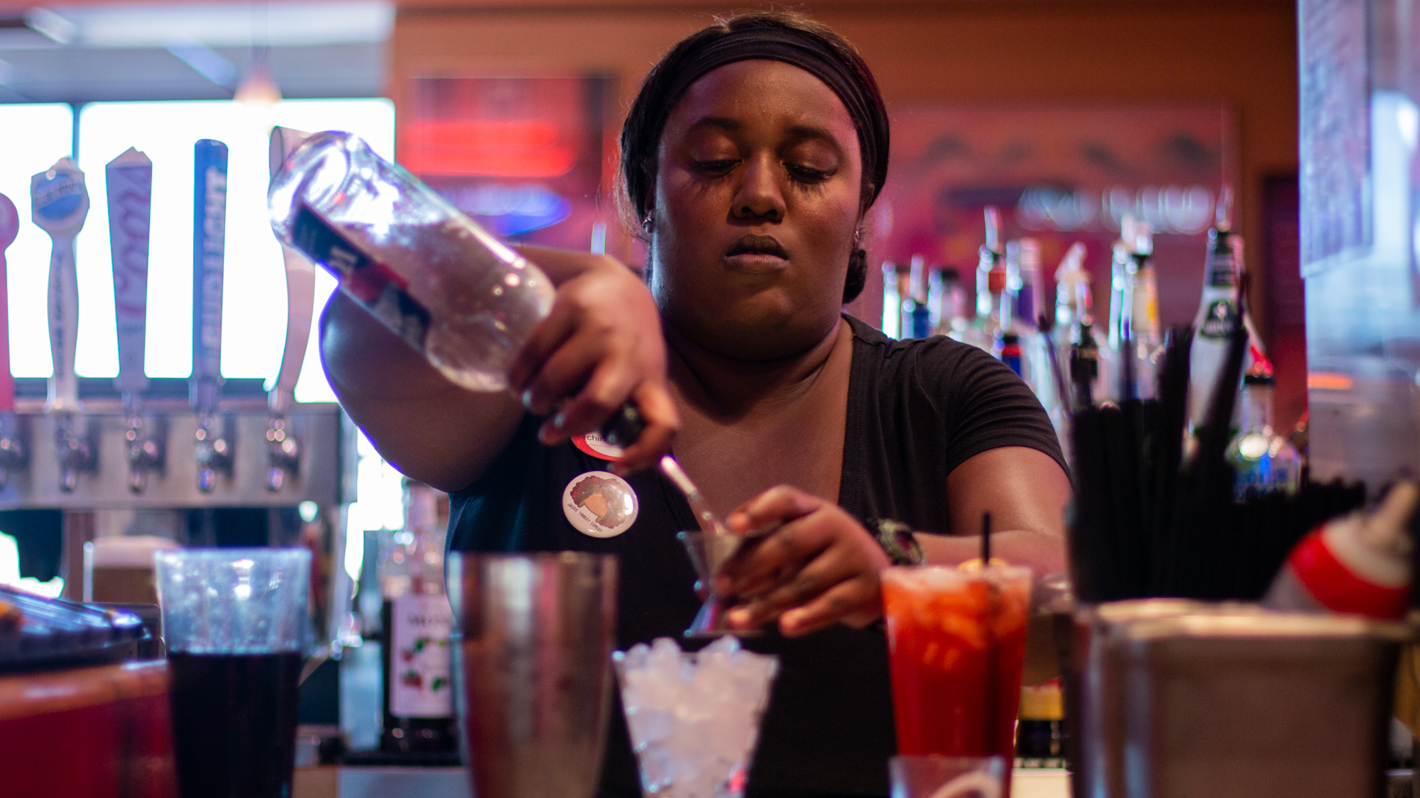  Chiniqua Bright, age 30, pours a cocktail at Red Robin in Mesa, Arizona on Sept. 29, 2018. Bright has been working at this restaurant for close to 11 years, while also juggling teaching and coaching responsibilities for the last seven. 