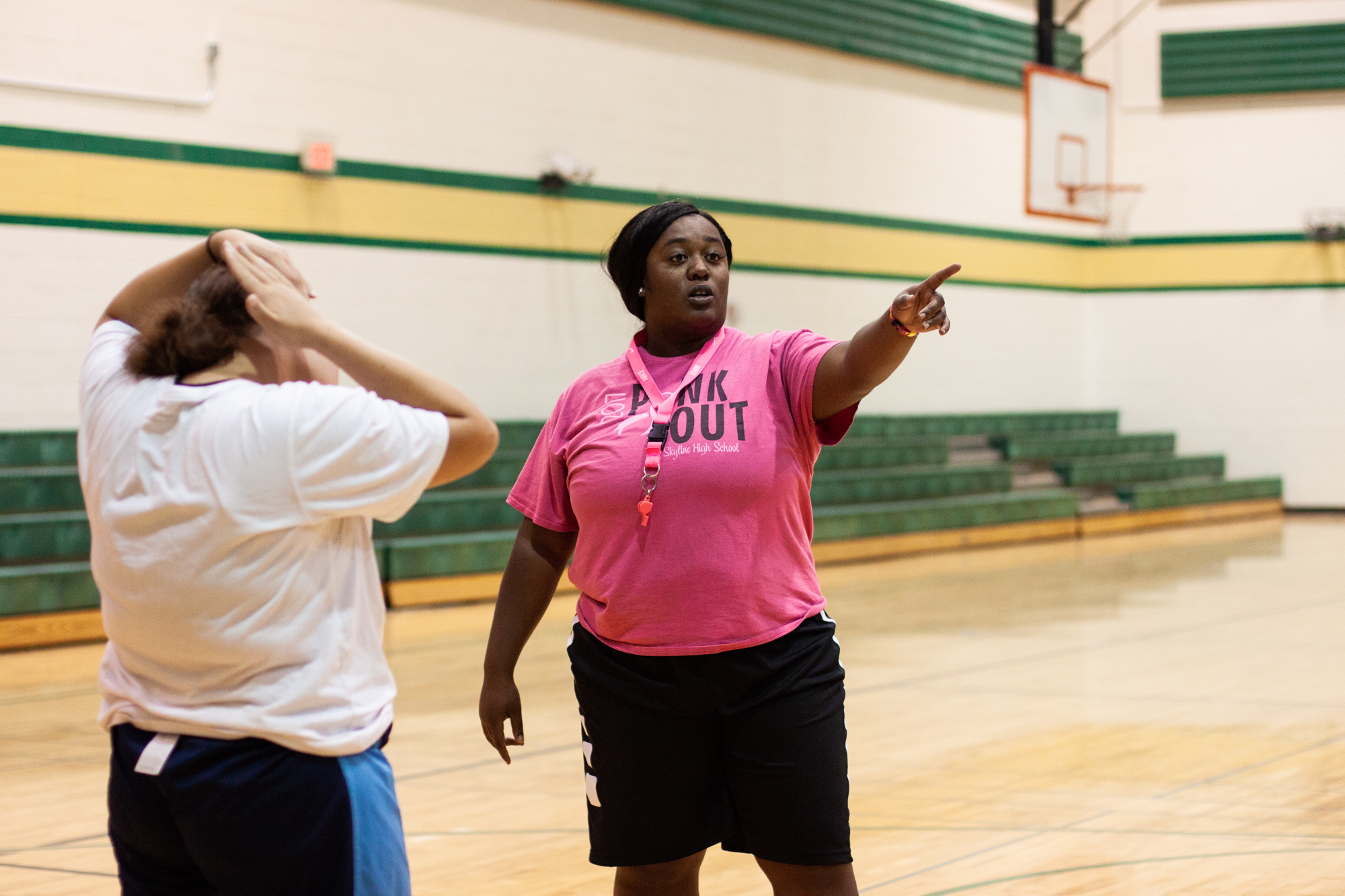  Chiniqua Bright directs students during an afternoon gym class on Oct. 3, 2018. In addition to teaching general physical education classes at Skyline High School, Bright also coaches the girls’ varsity basketball team. 