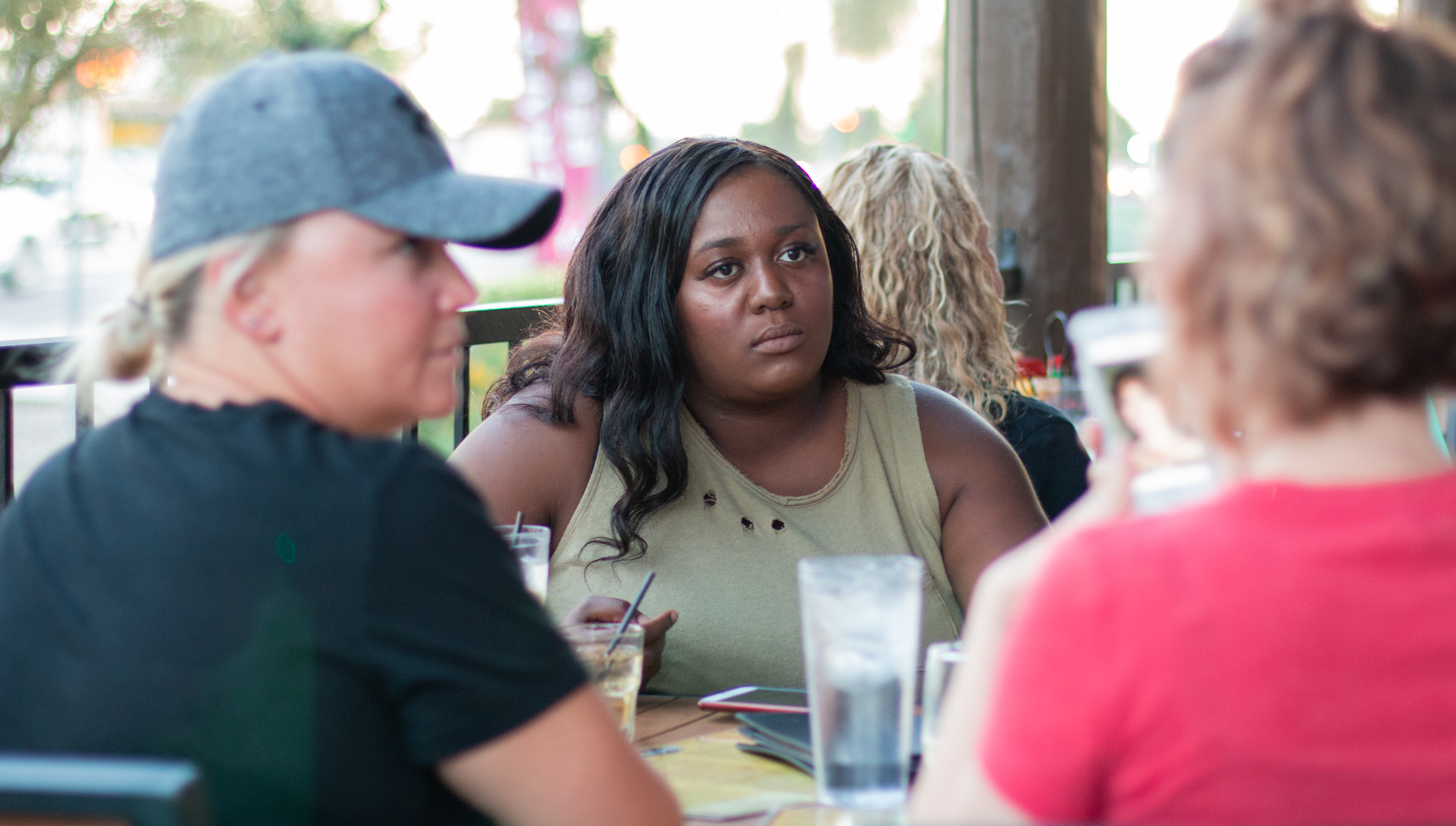  Chiniqua Bright has drinks with friends at The Hub Grill and Bar in Mesa on Oct. 25, 2018. Bright and her friends met at Skyline, where all three of them were coaches at one point. They all say they found their female friendship to be a comfort in a