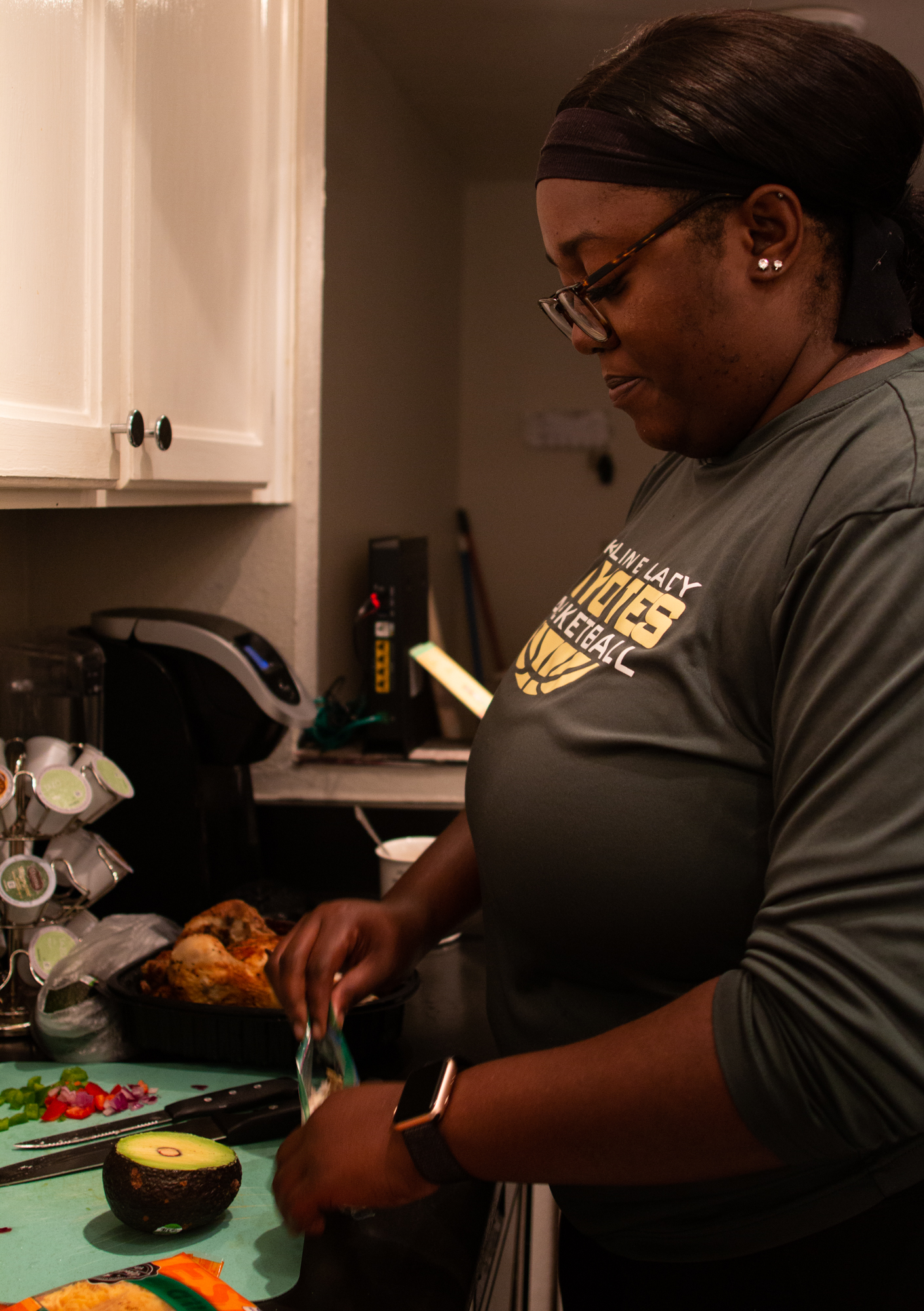  Chiniqua Bright prepares her lunch early in the morning on Nov. 15, 2018. She wakes up at 5 a.m. each day to get ready for work, often after nights of staying late at school for coaching or catching up on grading.  