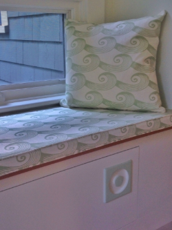 Detail shot (courtesy of the homeowner) of a Spiral Tide cushion and pillow by Oliveira Textiles. Note the "Cucumber" accent on the knob, too.