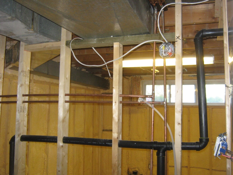 This non-load bearing partition wall contains both plumbing and electrical components