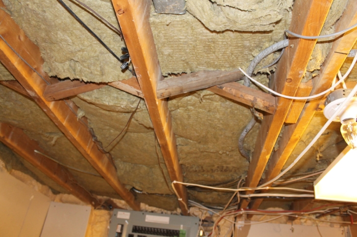 Absorptive ("Safe N Sound") insulation installed between the joists before metal channels and drywall goes up