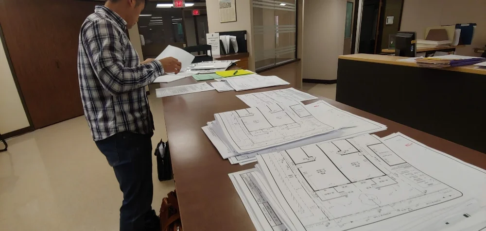 THE PILE OF DOCUMENTS THAT WERE SUBMITTED TO THE CITY BUILDING DEPARTMENT