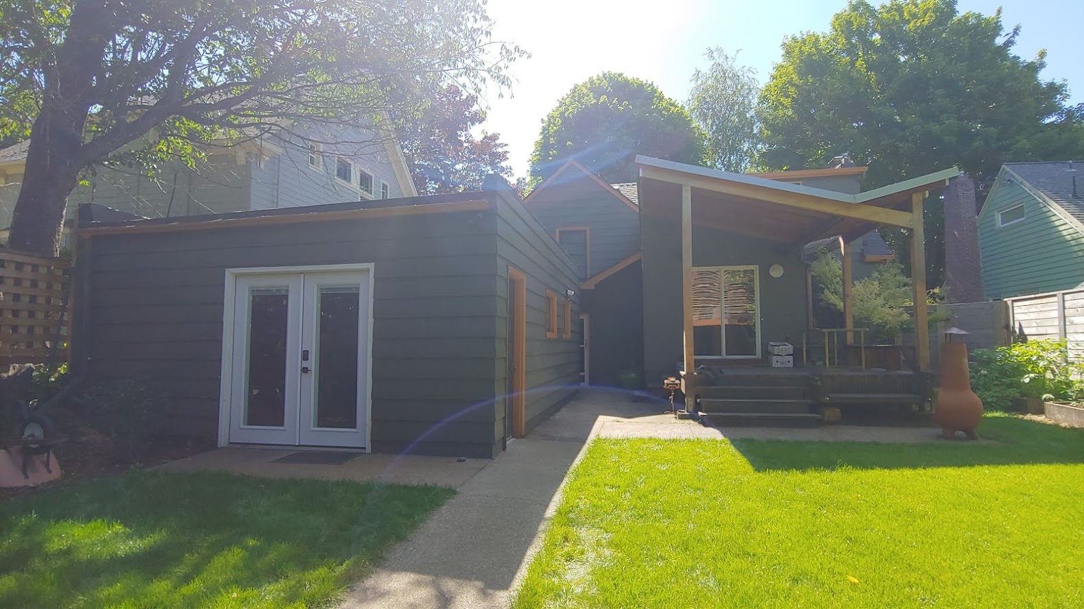 Here’s the shared backyard space between the main house and the detached suite in the back - There’s no shortage of outdoor amenity space.