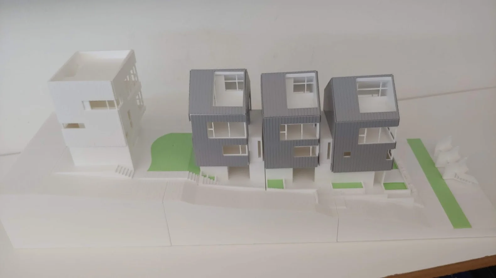 Here’s a model of 4 new houses that were constructed on what was a single family lot approx. 50’ x 160’. Only 1 parking space is required for each house.