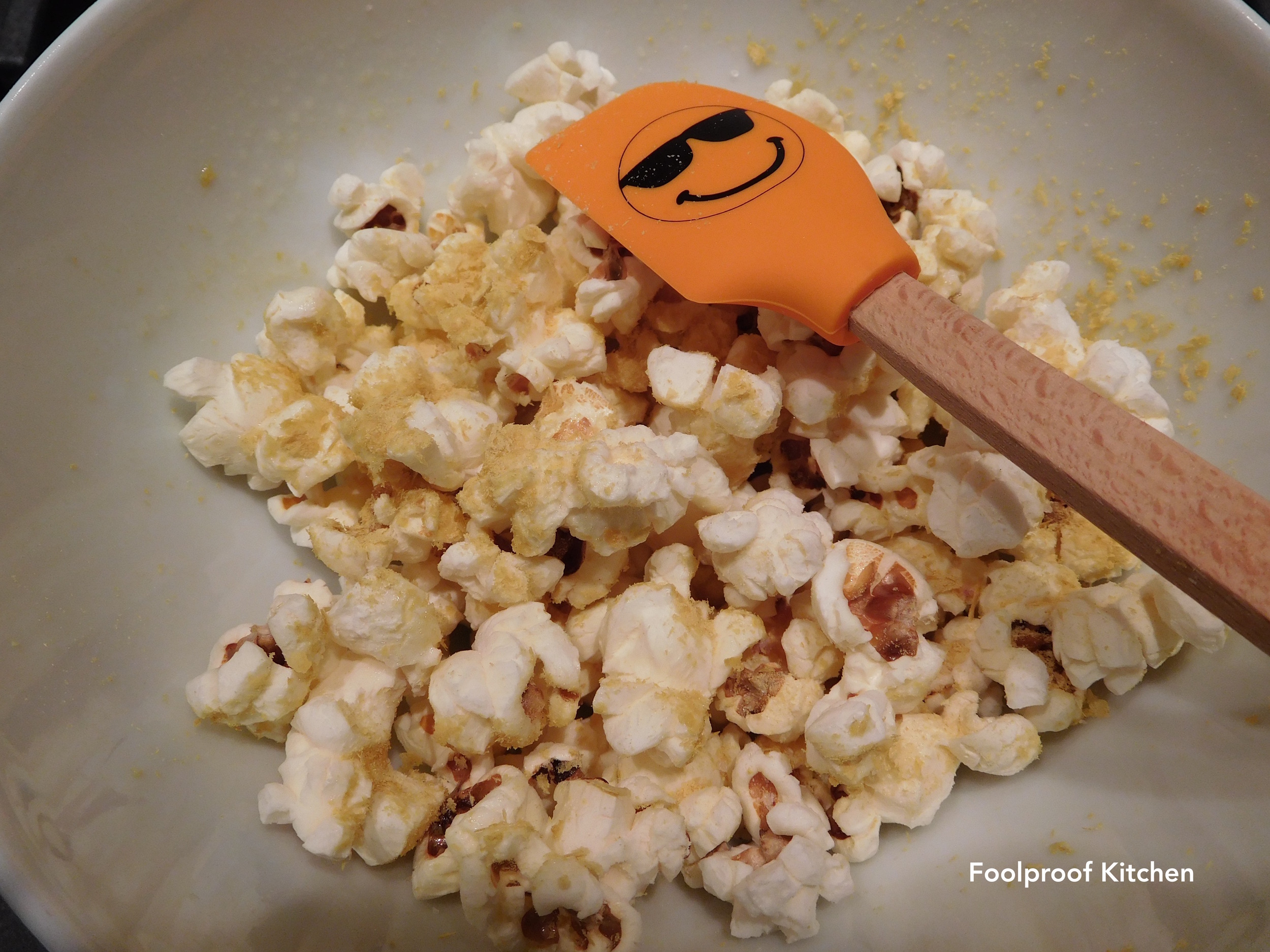 Popcorn with salt and nutritional yeast, and a smiling spatula, of course.