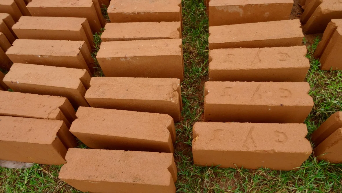 Bukoba bricks. Made from soil, compacted, then fired. You can find these across the villages in TZ but not in the same color. Bukoba has deep red soil. 