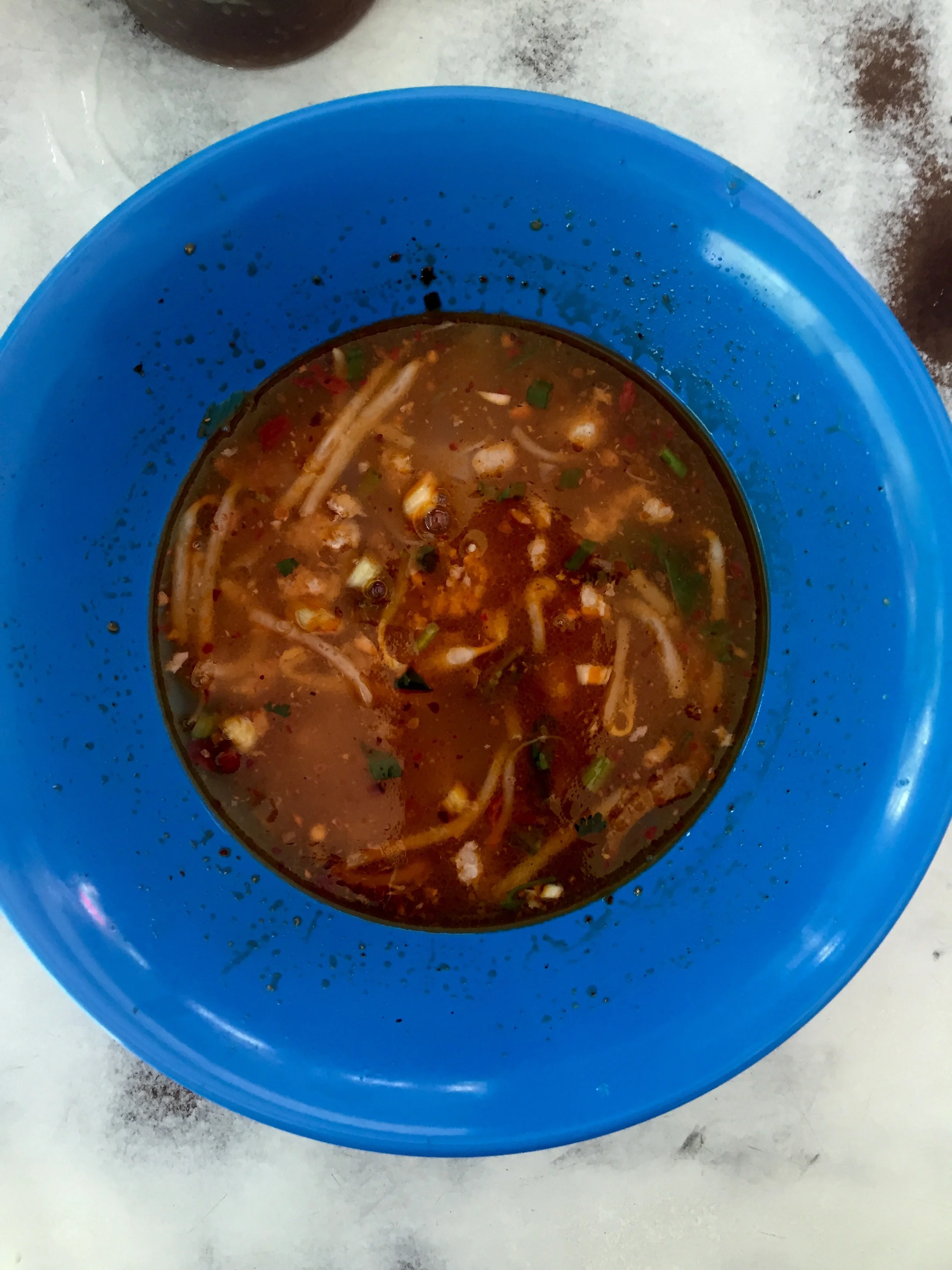 After mixing and slurping, this is how the broth should look. A deep blood like color with all the good pork juices sticking to the sides of the bowl. Yum!