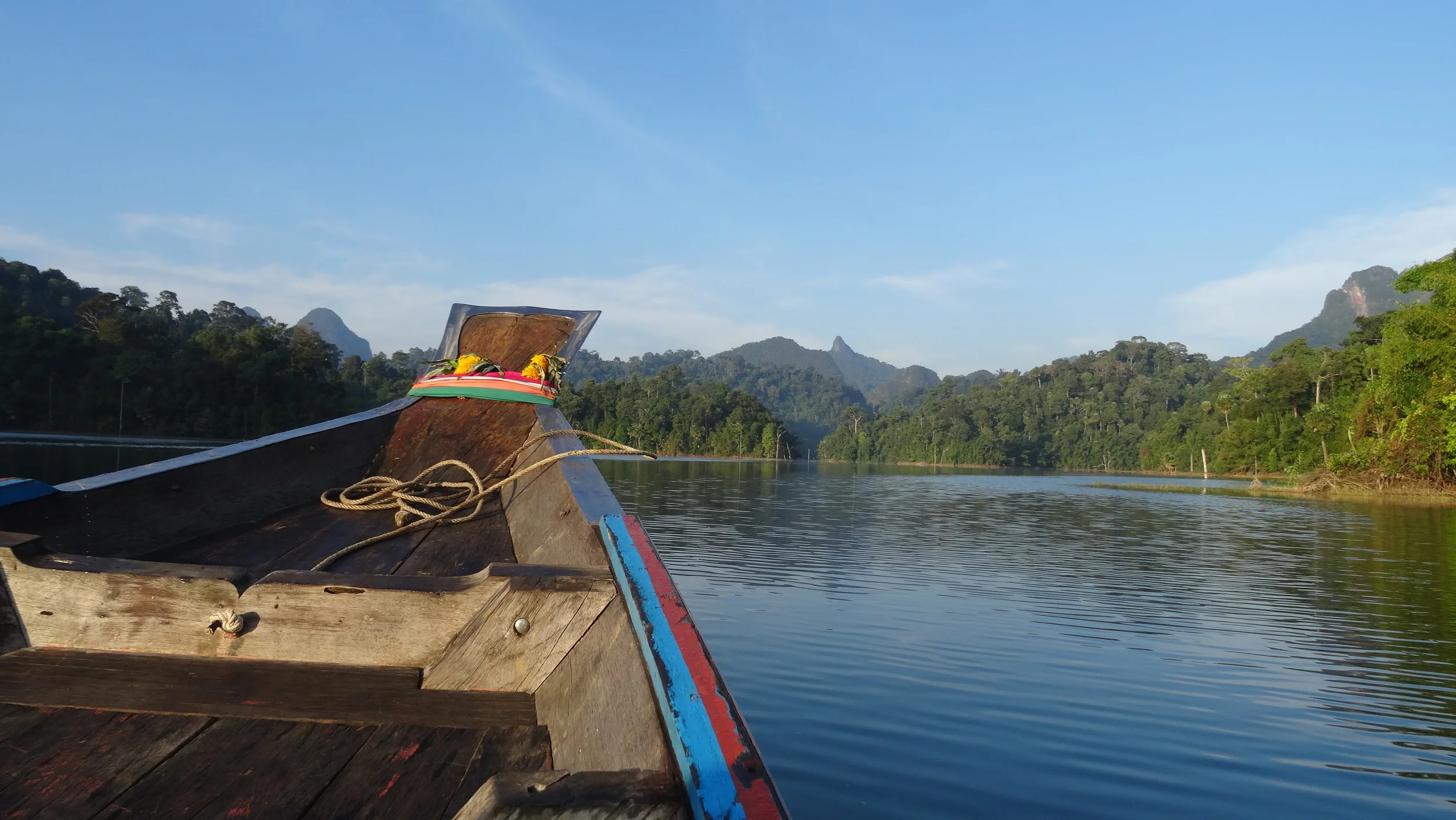 Aboard the traditional Thai long tail boat. This is how everyone gets around the lake since there are no roads. 
