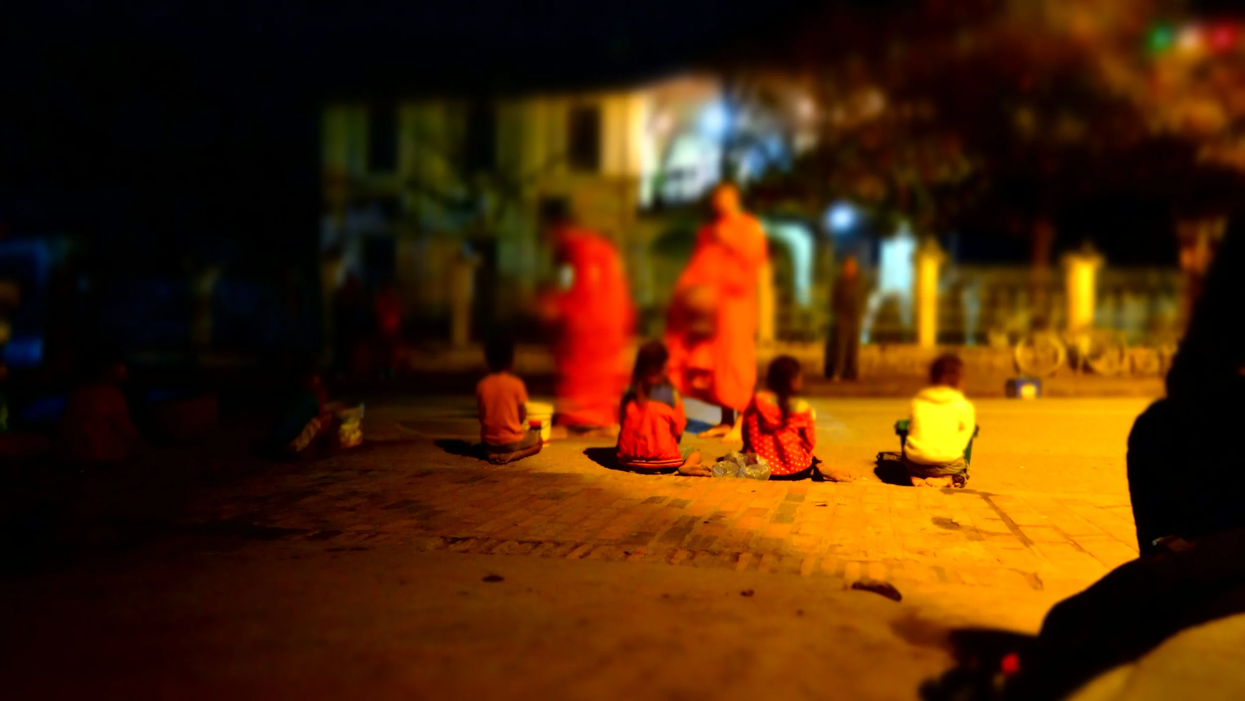 Early morning Alms giving ceremony. Typically the locals will give gifts to the Buddhist monks, but children also line the streets in hopes that the monks will give sweets to them. This was a powerful scene and one that I'll never forget. Just remember, if your a tourist, be sure to obey the local customs. 