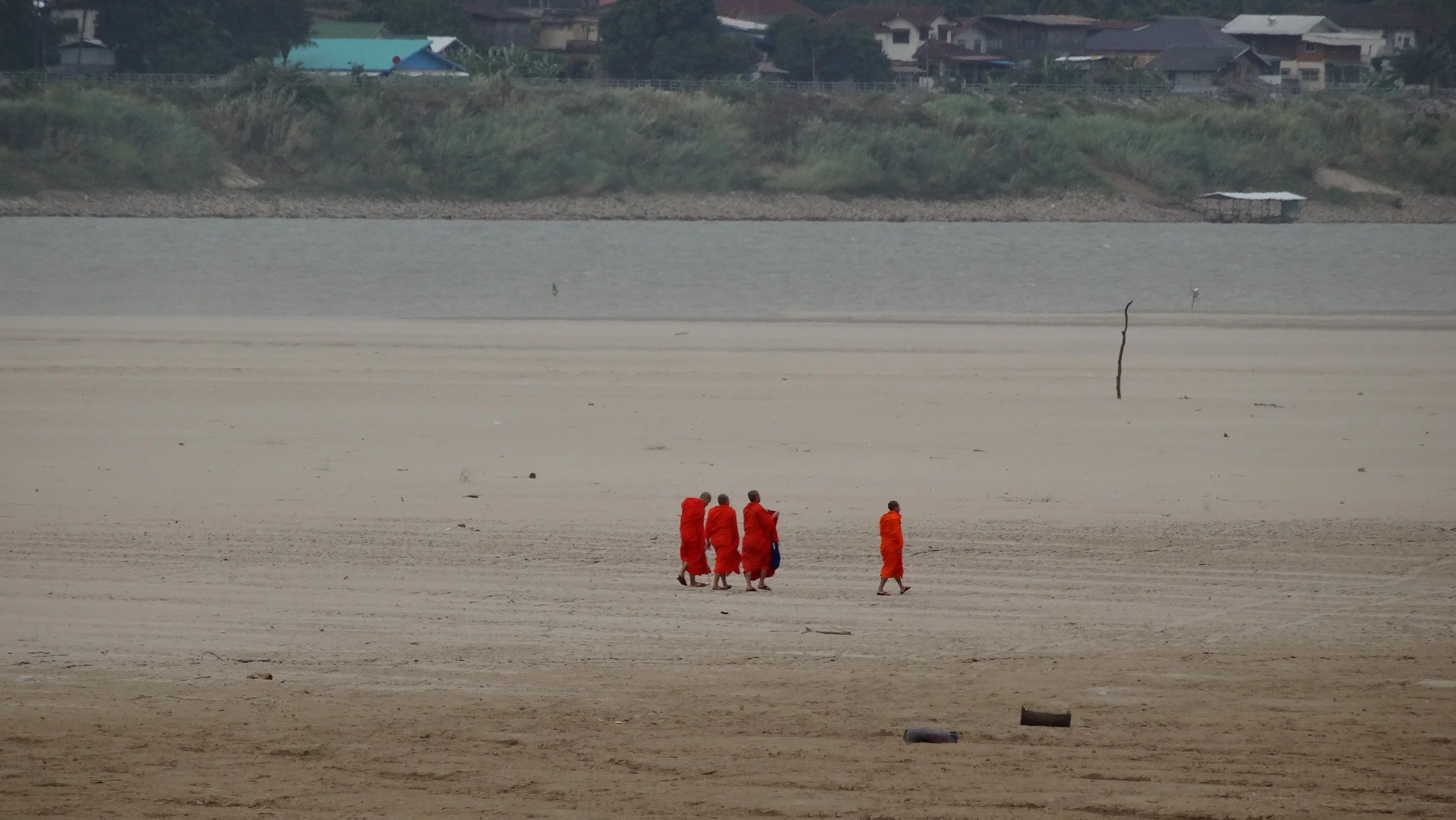 Munks at the Mekong. Vientiane, Laos.