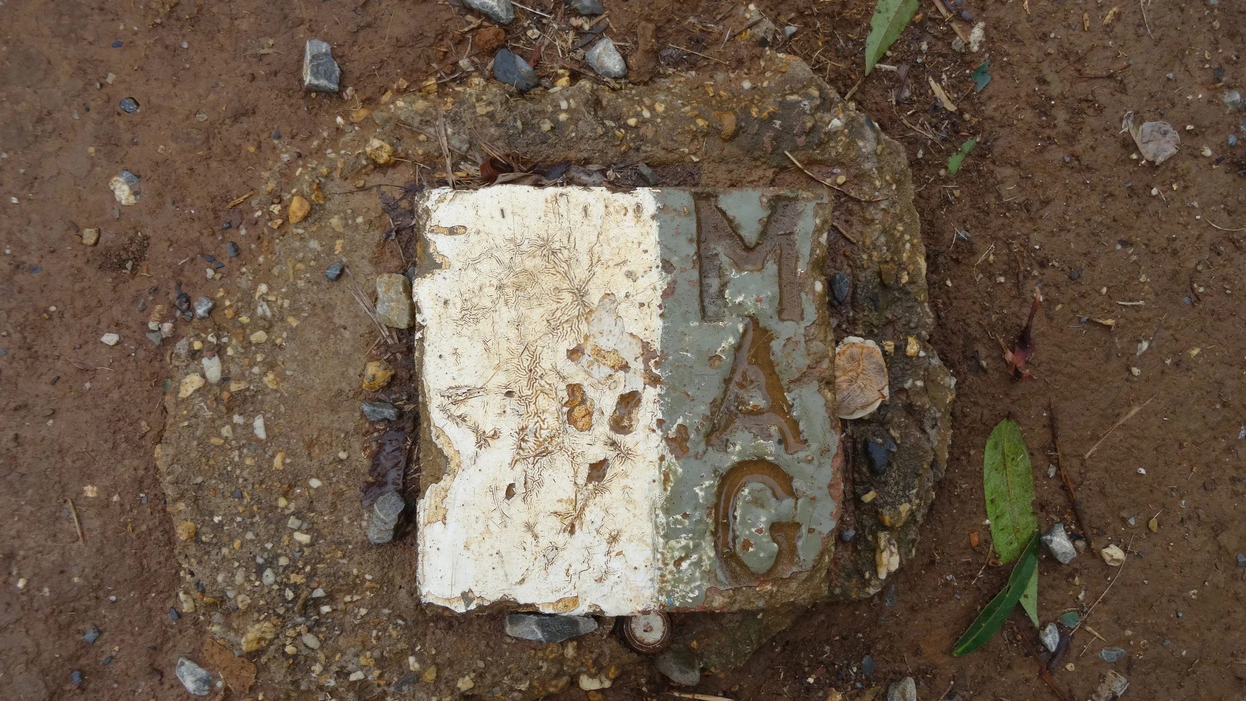 Mine Advisory Group (MAG). This marker lets you know the boundaries that have been cleared and are now bomb free in the area. 