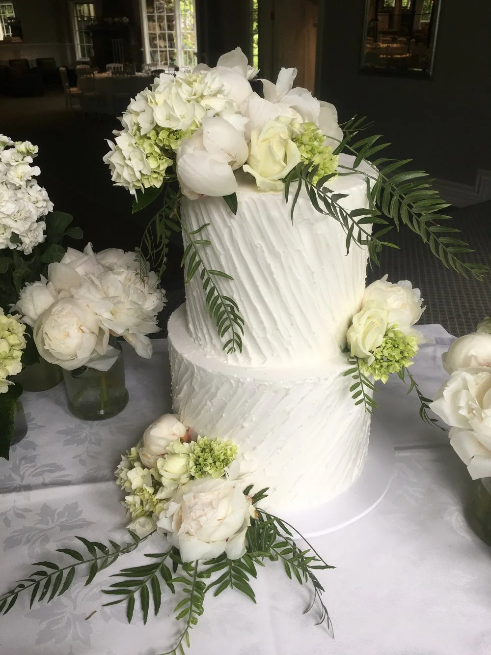 Diagonal Lined Buttercream with Fresh Green & White Flowers
