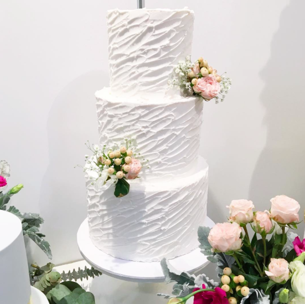 3 Tier Buttercream Cake with Jagged Diagonal Lines & Fresh Flowers