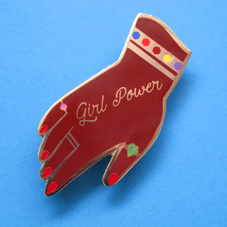 Kitiya Palaskas girl power pin.jpg
