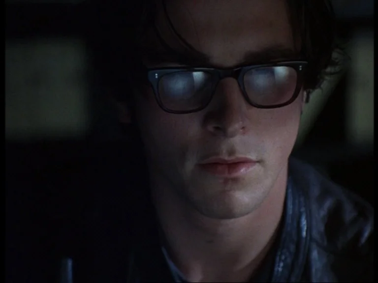 Arthur Stuart (Christian Bale) heavily immersed in research.