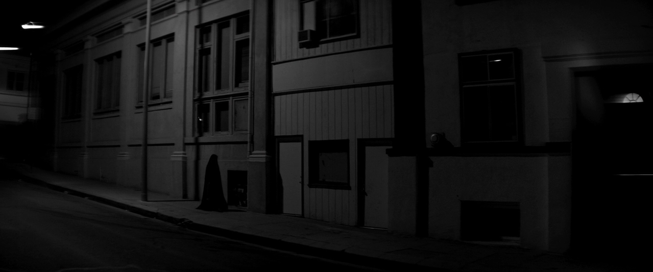 The Girl (Sheila Vand), out for a night stroll in Ana Lily Amirpour’s A Girl Walks Home Alone at Night (2014).