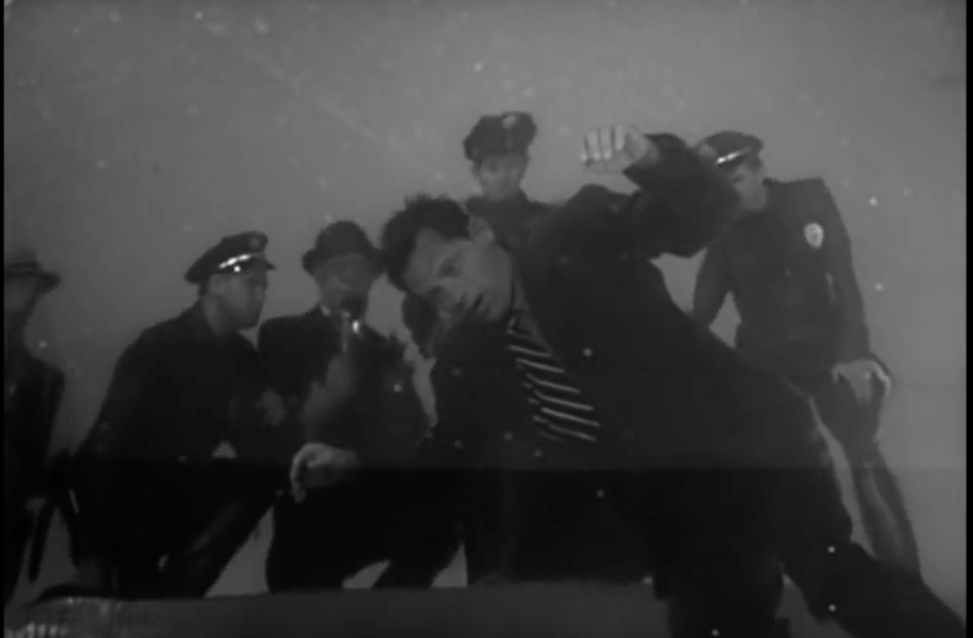 Police & reporters crowd around the floating corpse of Joe Gillis in Sunset Boulevard .