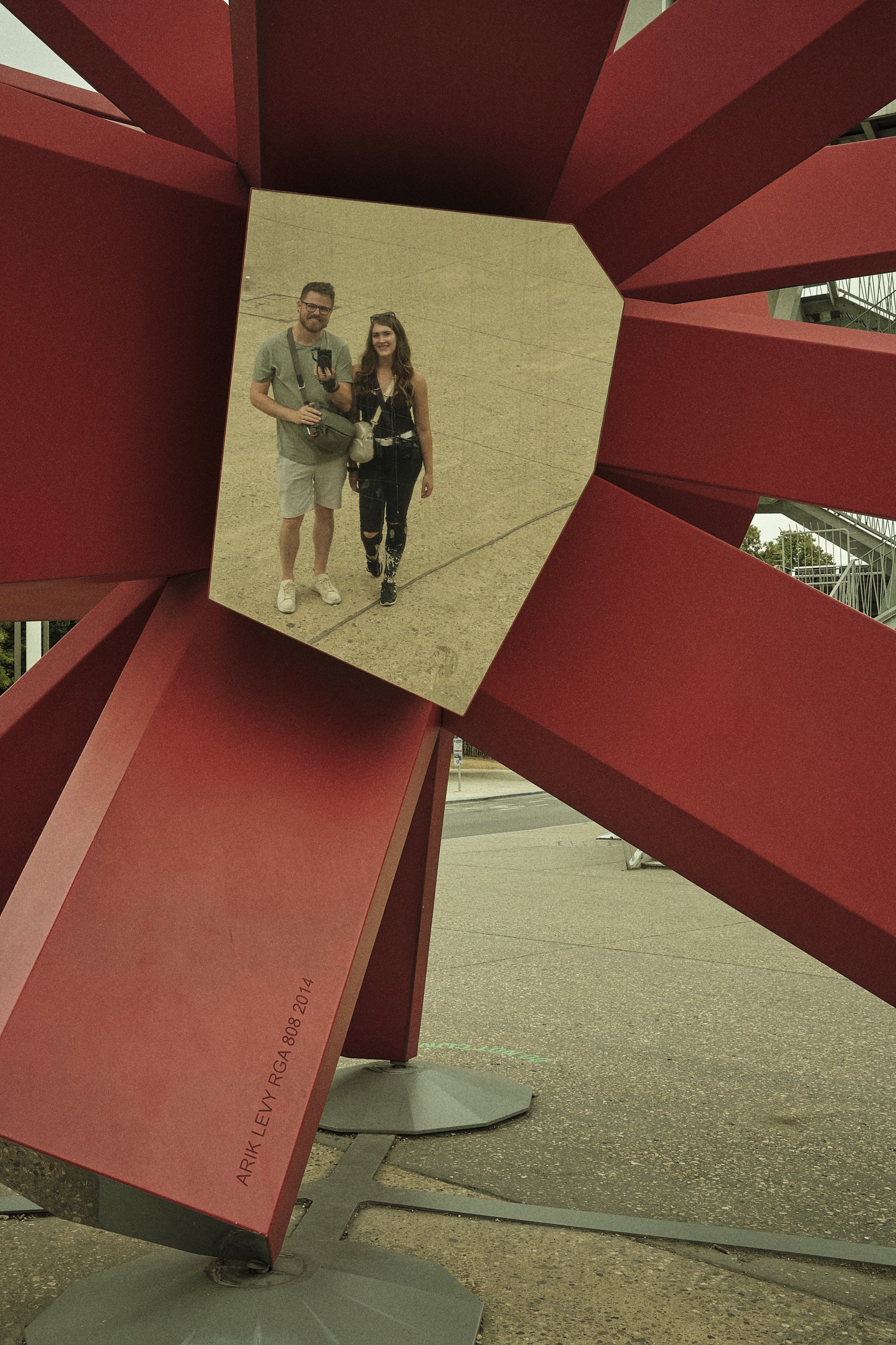 Exploring Together: Connor and Krysta's Reflective Moment at the Atomium