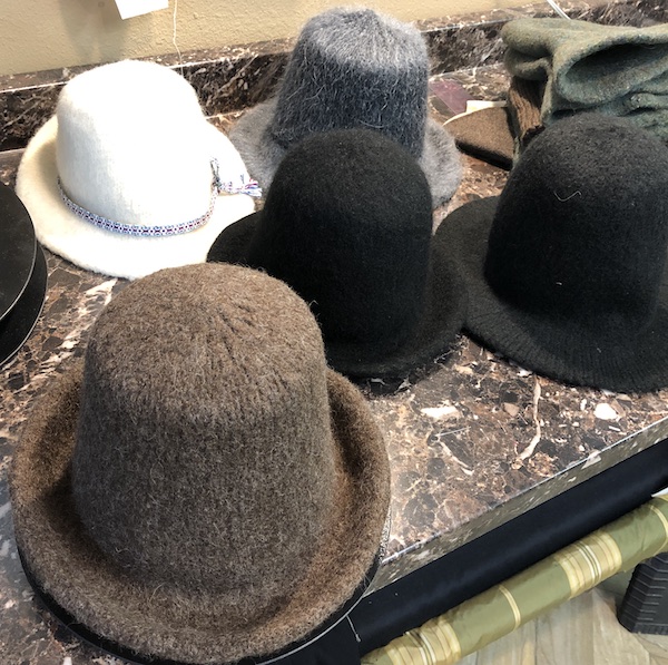 All of our test knits on one table, the most recent sitting on the bottom left.