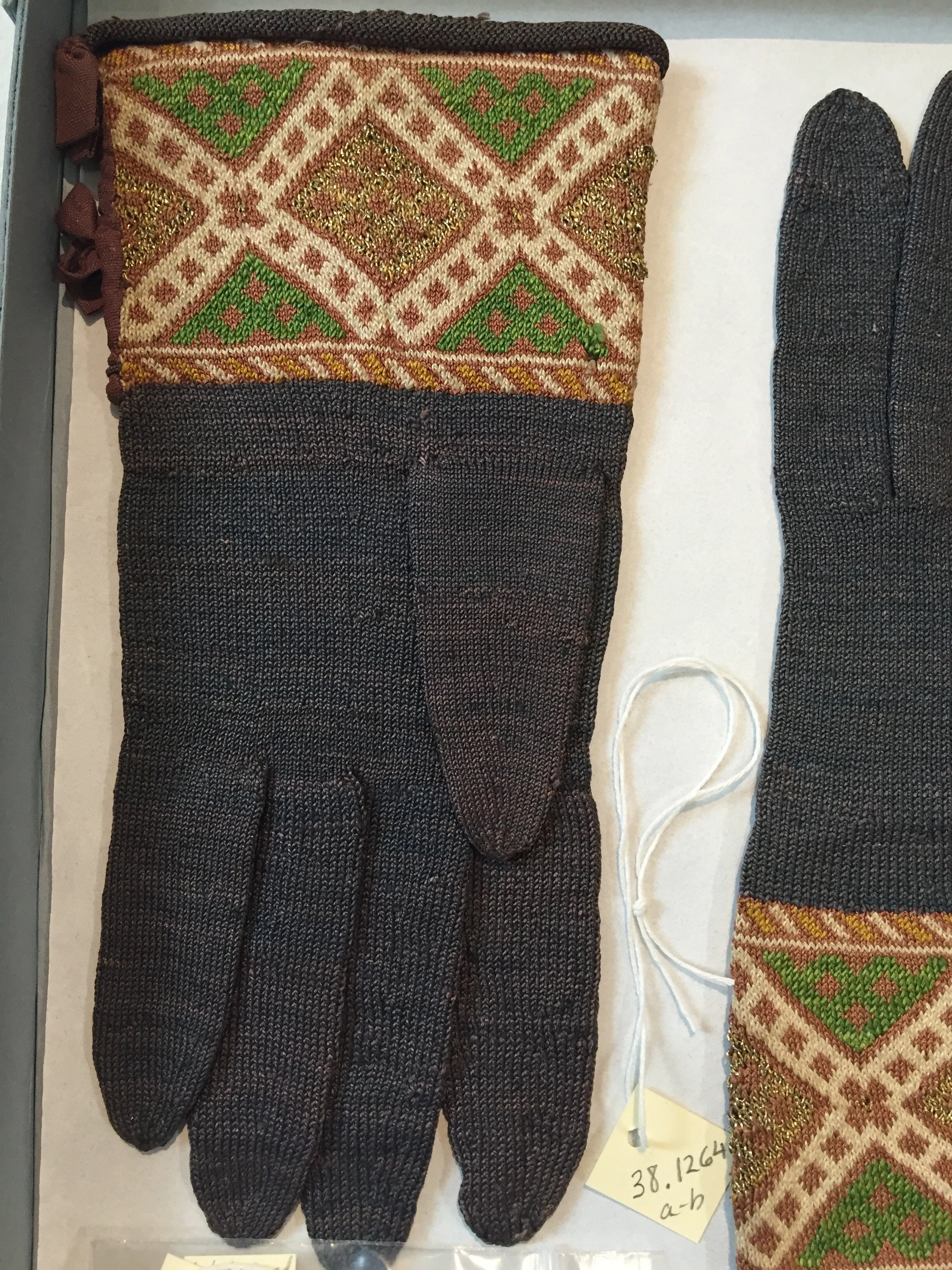 A pair of silk and metallic gloves in the Boston Museum of Fine Arts, Mid-17th century. In the cuff, there are a minimum of 3 colors used at a time with an additional 4th color periodically.