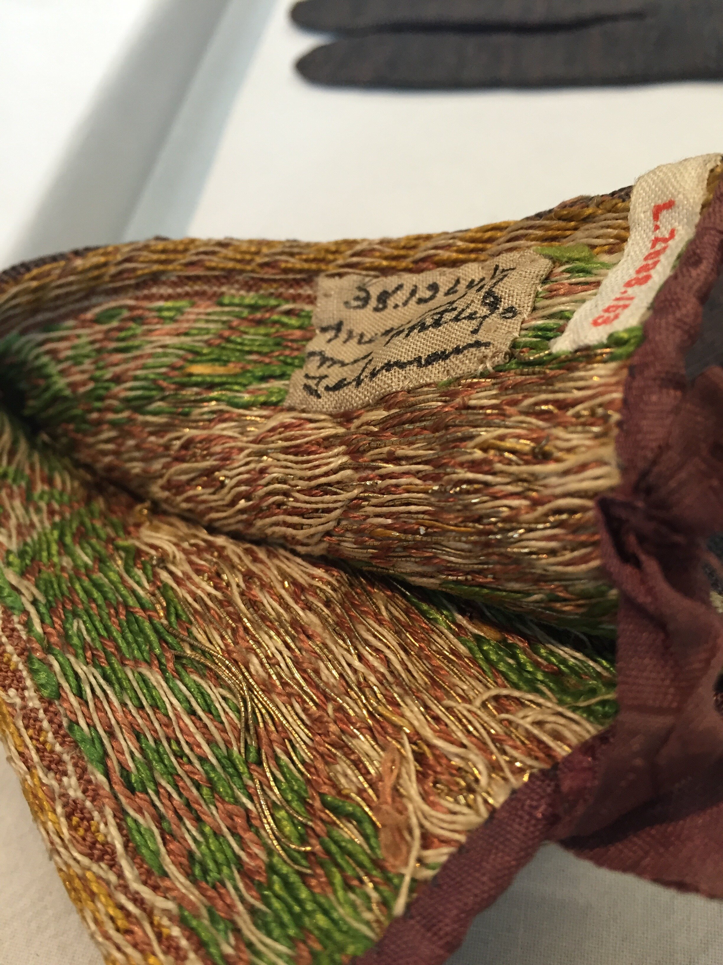 The back side of the color work cuff on the silk gloves, showing the incredible mass of stranding across the back of the work. The gold, though isolated is still carried across the whole row.