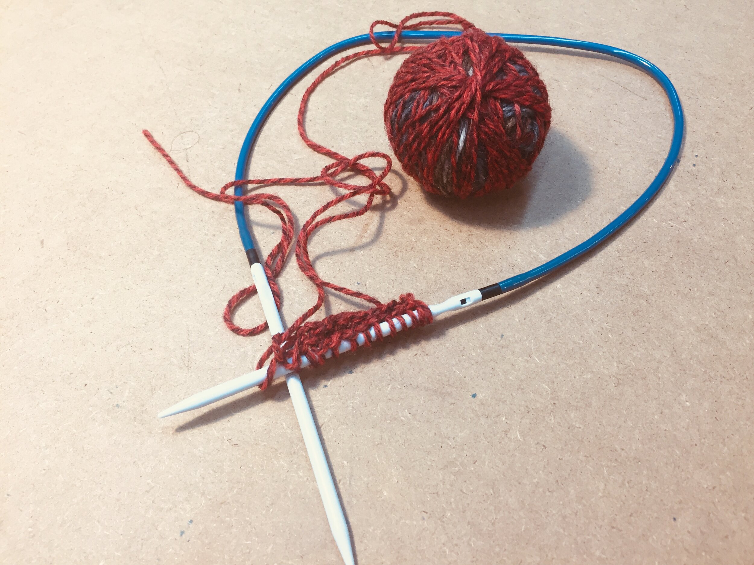The beginnings of a triangular shawl on circular needles.