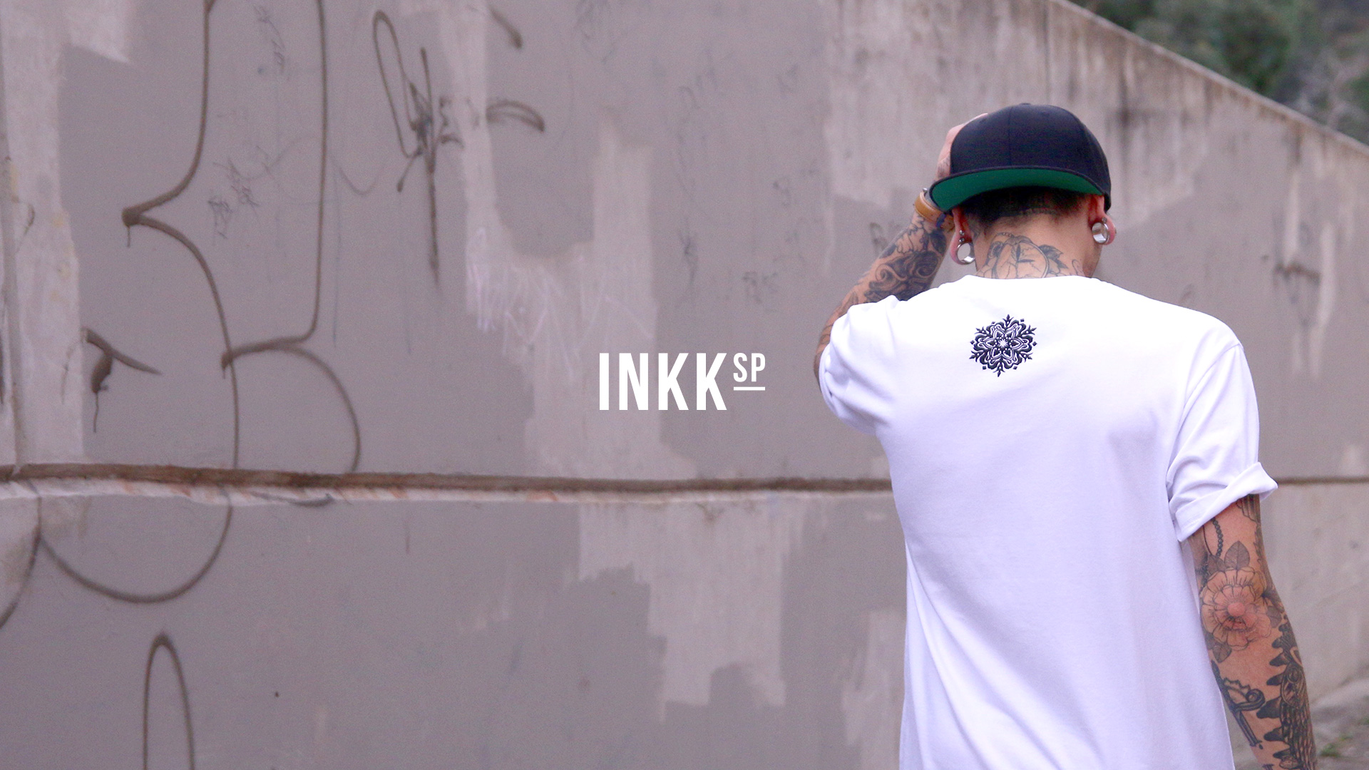 INKKsp — Logo on guy wearing tee with mandala print back detail