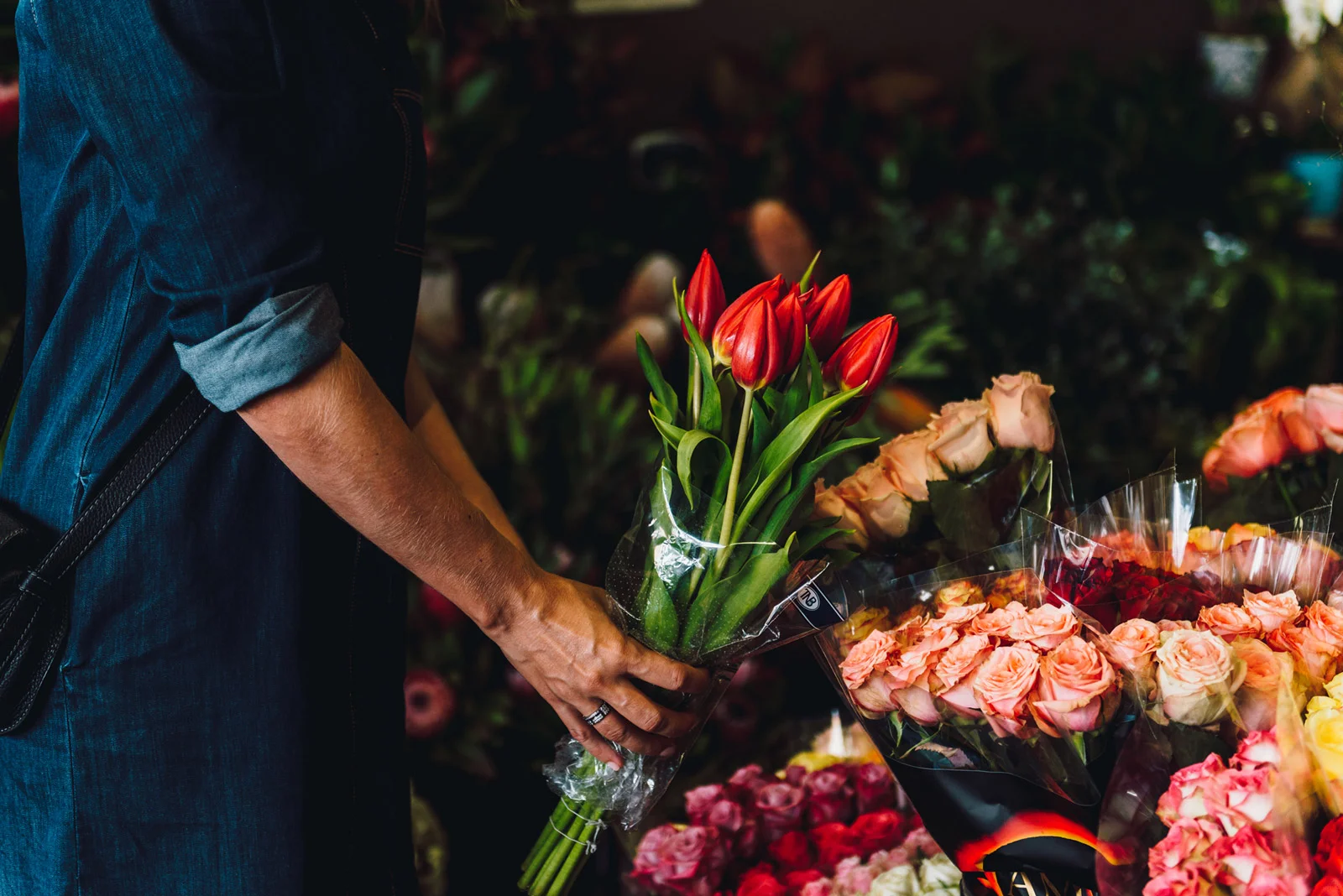 Lifestyle Property Development photoshoot womans hand picking flowers