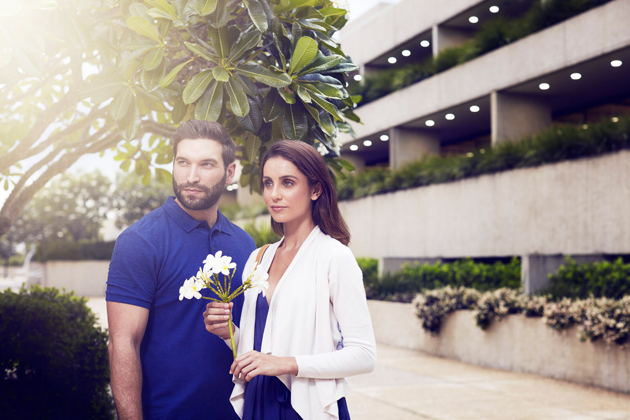 Photoshoot property Development advertising campaign Man and woman hold flower