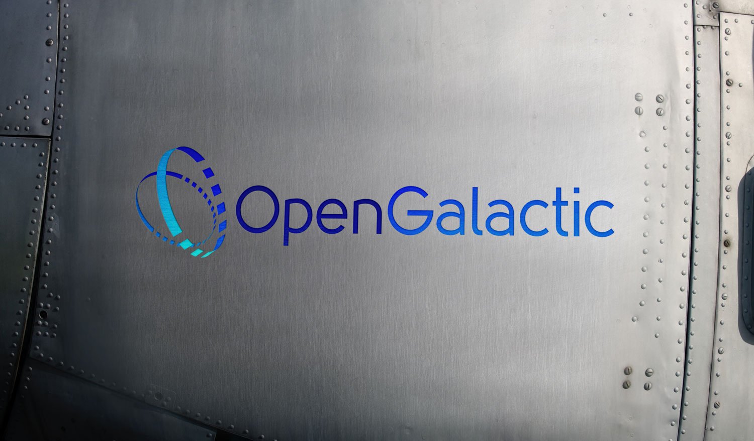 Award winning designed logo for Open Galactic shown on side of satelite