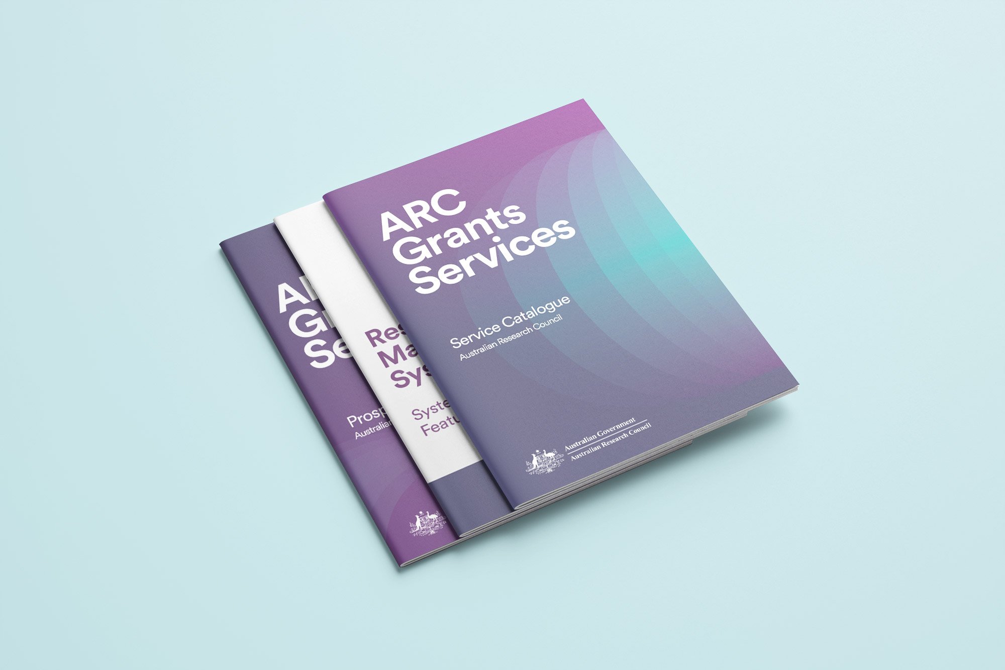 Three brochure covers stacked showing the bold front cover designs for the service catalogues