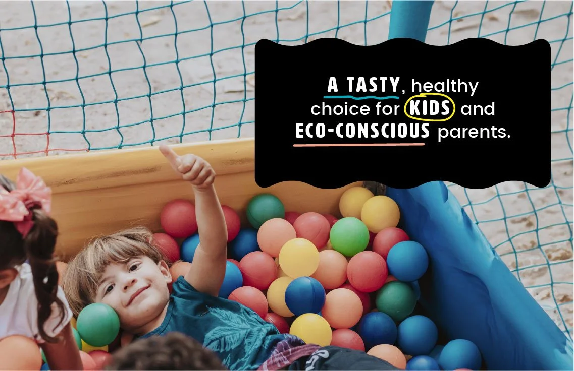 Child playing in ball pit along with brand messaging reading 'tasty healthy choice for kids and eco conscious parents'