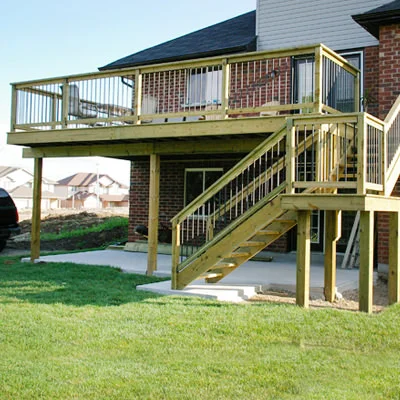 SIMPLE ELEGANCE Elevated decks don’t have to look like awkward add-ons. This two-tier deck takes advantage of a basement walkout and provides the perfect space to enjoy that view. 