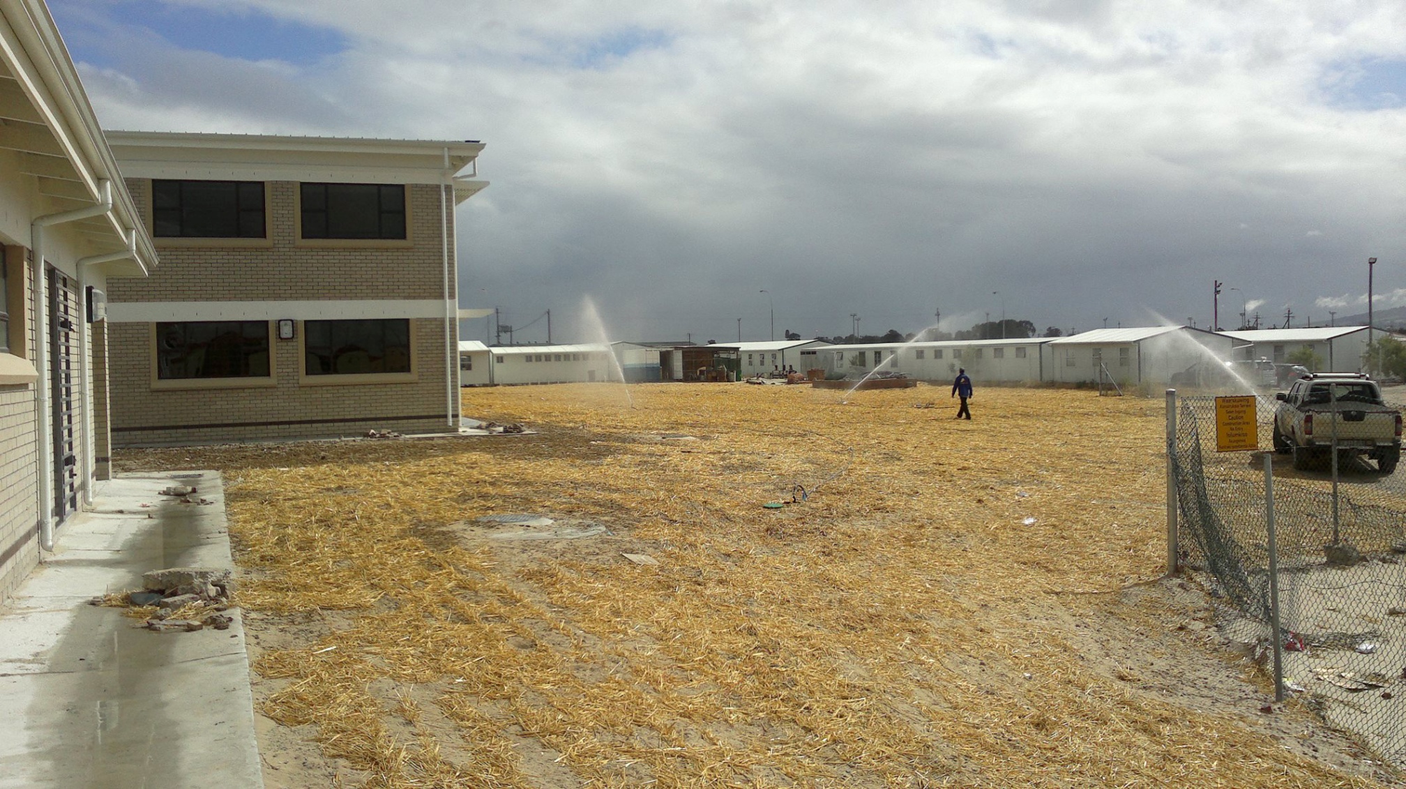 Irrigation of newly-seeded sports field at school in Delft.