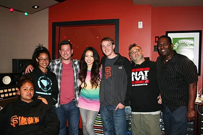 Pictured (L-R) at Studio Trilogy are students Mariacel Gutierrez and Kianna Farr-Zunig, FYR founder Jason Wall, singer Thia Megia, engineer Tyler Crowder, songwriter/producer Ben Thompson, and composer/producer/multi-instrumentalist Mo Pleasure.