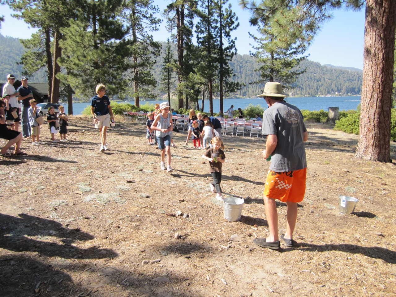 Robbie Stuart (Cabin 75) supervising children's water relay. Thanks, Robbie!