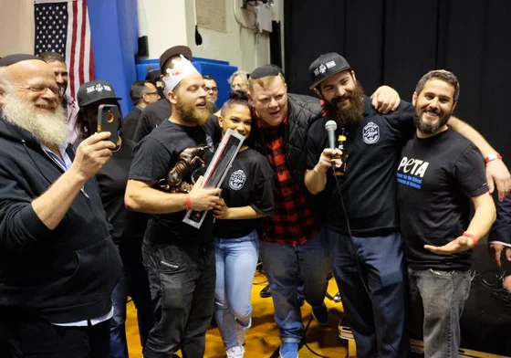 Three winners of Brisket King — Sruli Eidelman, Billy Durney, and Ari White — pose at the 2017 Brisket King where Eidelman won the crown