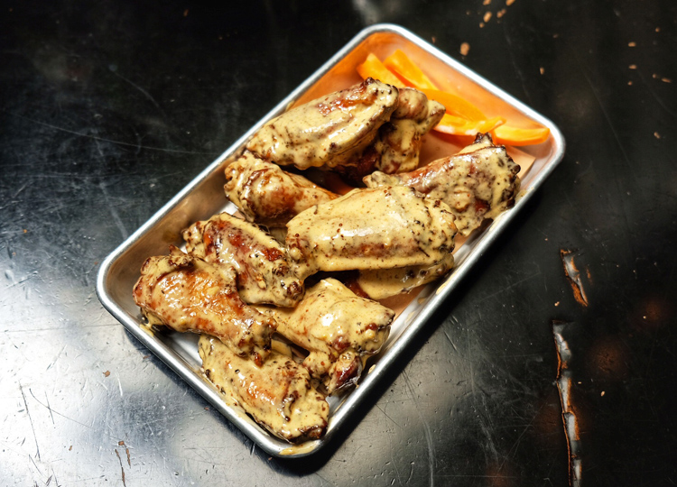 The smoked wings with Alabama white sauce at Blue Smoke are some of the best wings in all of NYC.