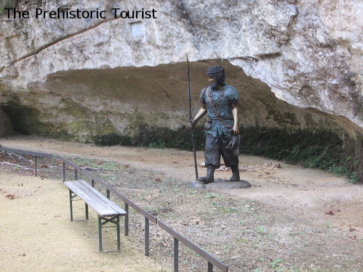 The site of the discovery of the bones is marked with a plaque and a statue of a Cro-Magnon man