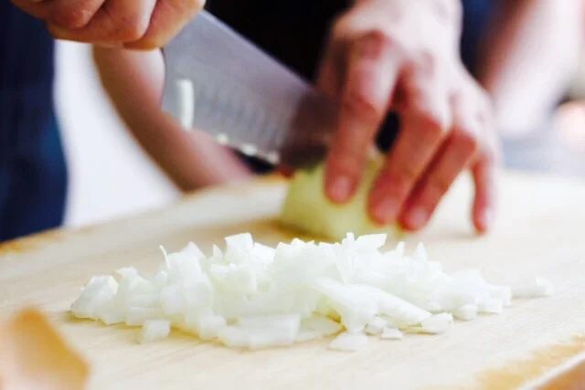 Chop up your onions and ginger - careful with your fingers of course! (PS knife is from Fint & Flame UK before we get lots of emails - yes it's fantastic!)