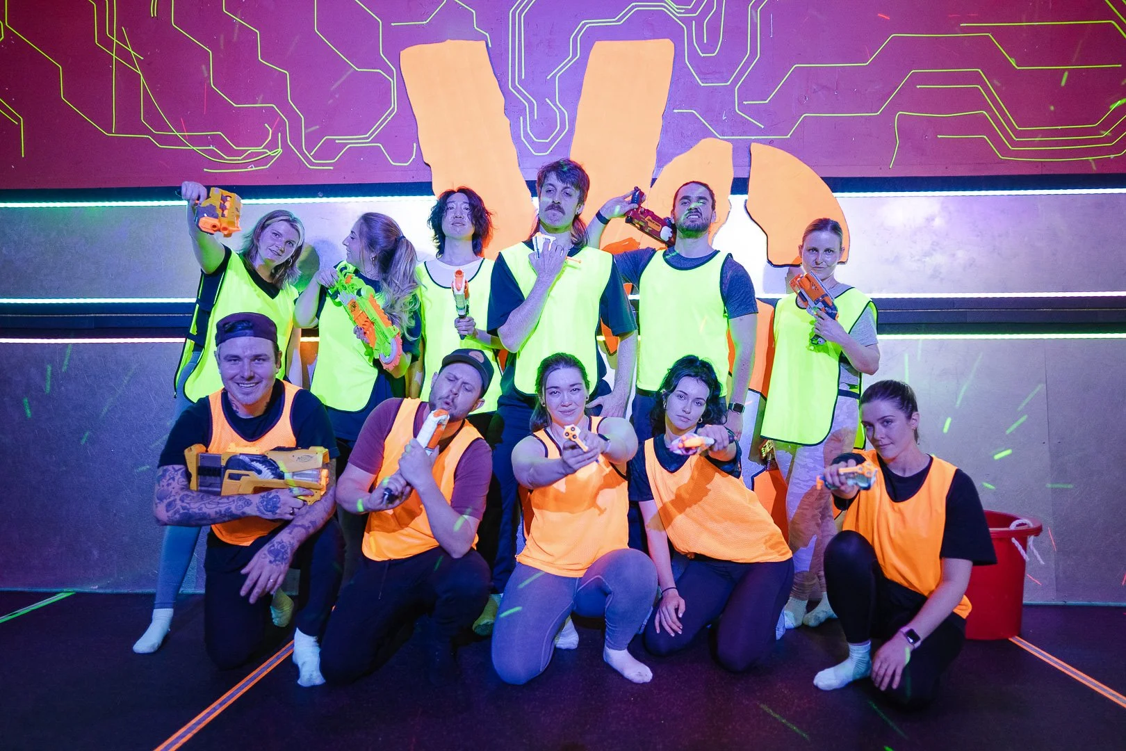 Coworkers participating in a Nerf battle team building activity in Toronto