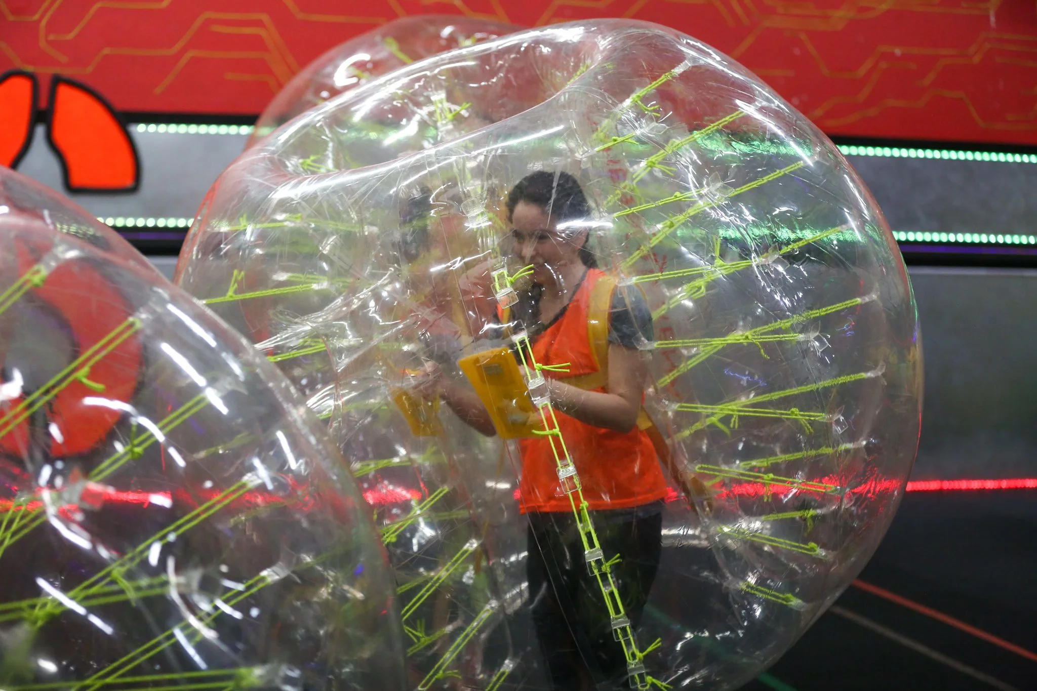 Friends laughing while playing Bubble Soccer in Toronto