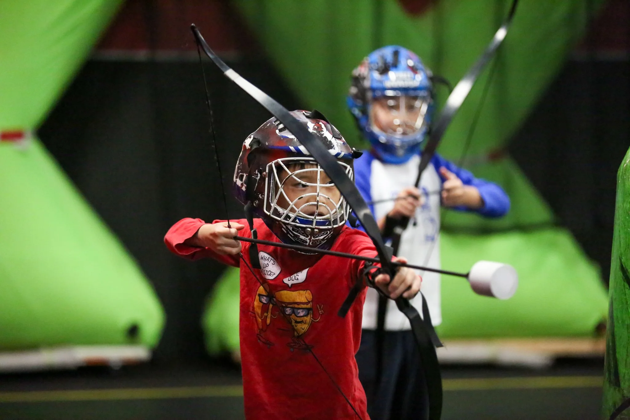 kids playing indoor combat archery in North York, Toronto