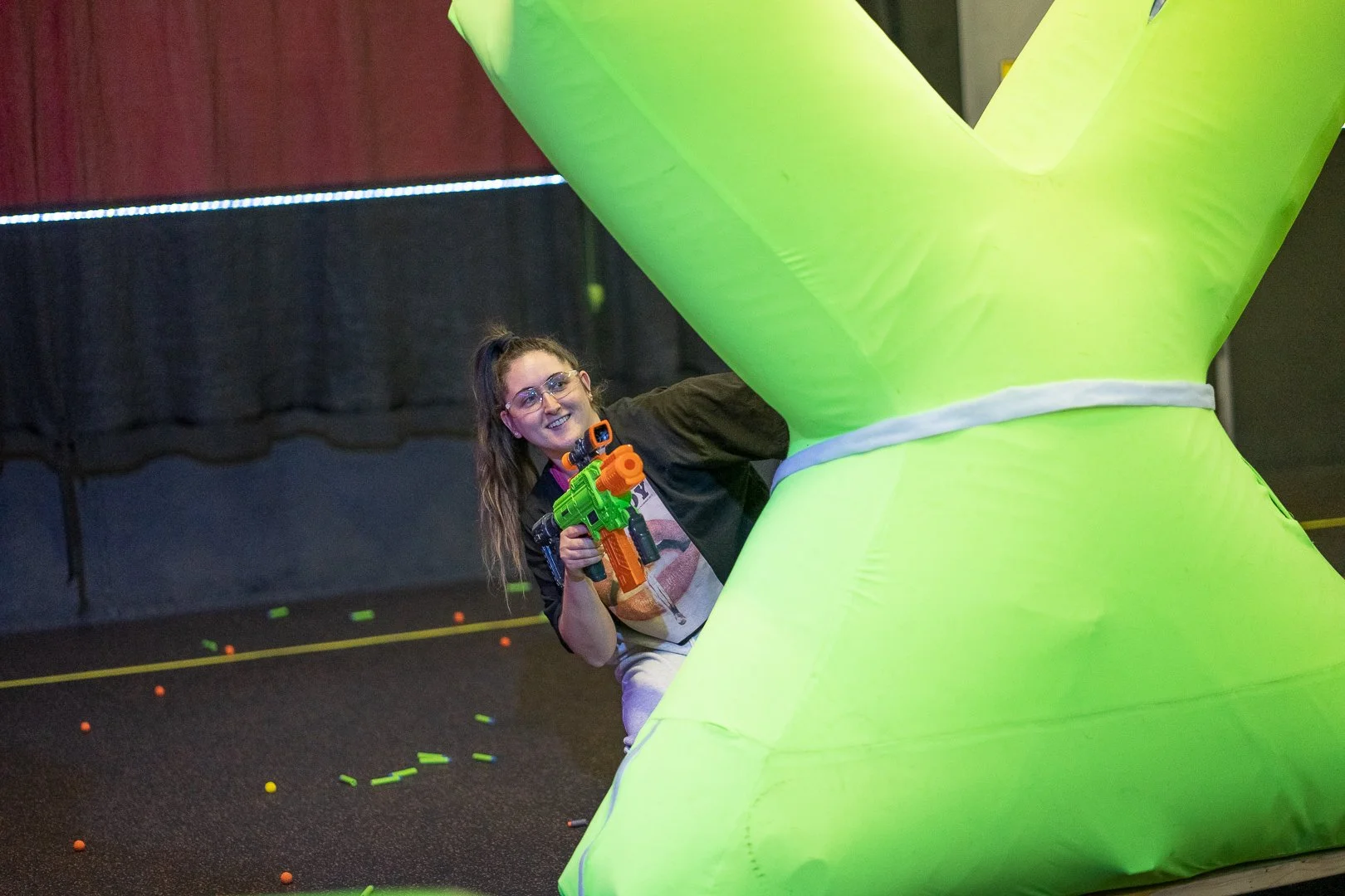 Friends competing in indoor Nerf Battles in Toronto