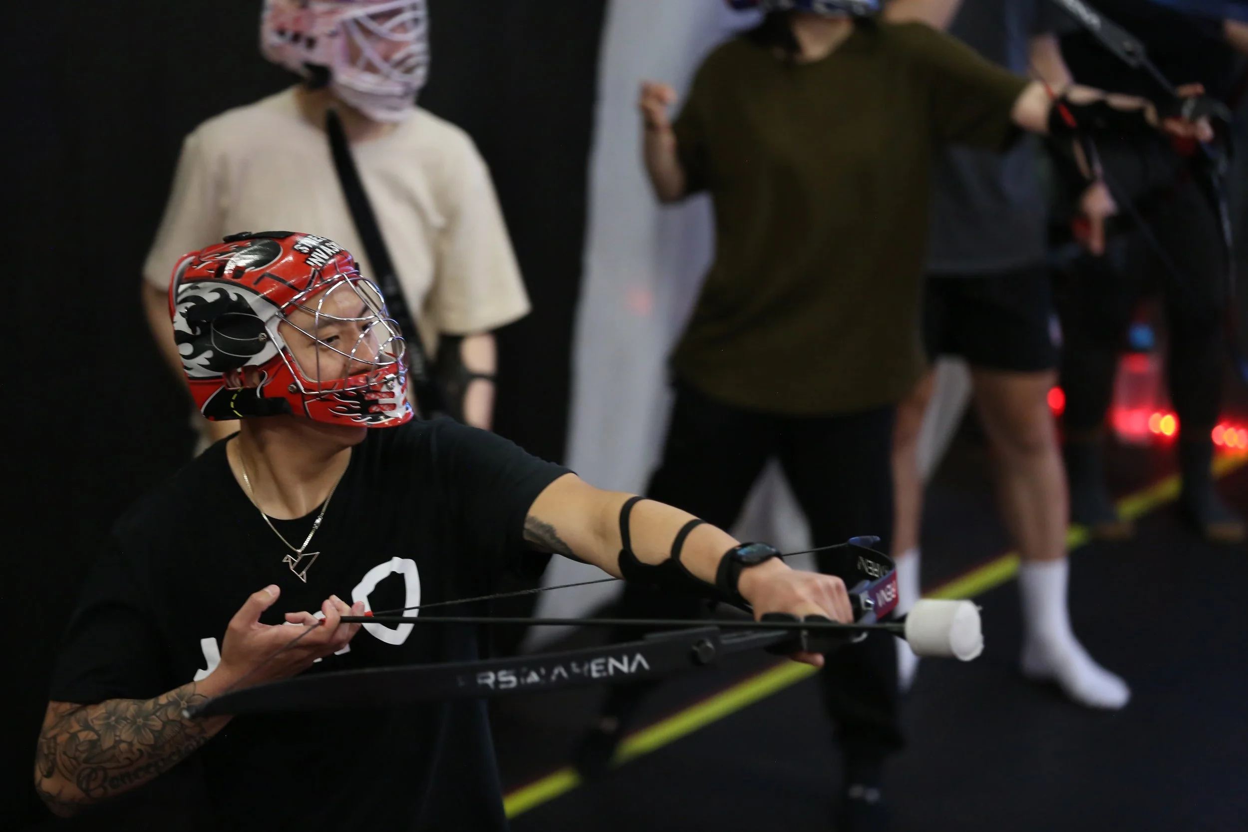 Coworkers playing Combat Archery during a corporate team-building event in Toronto