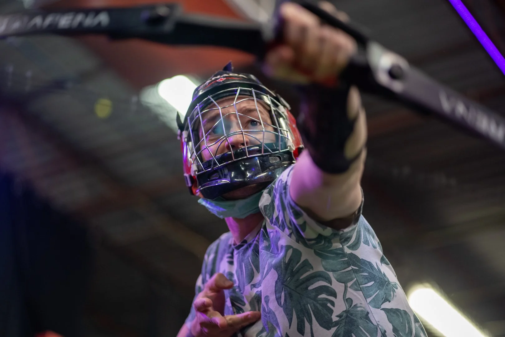 Employees playing combat archery during a corporate team building event in Toronto