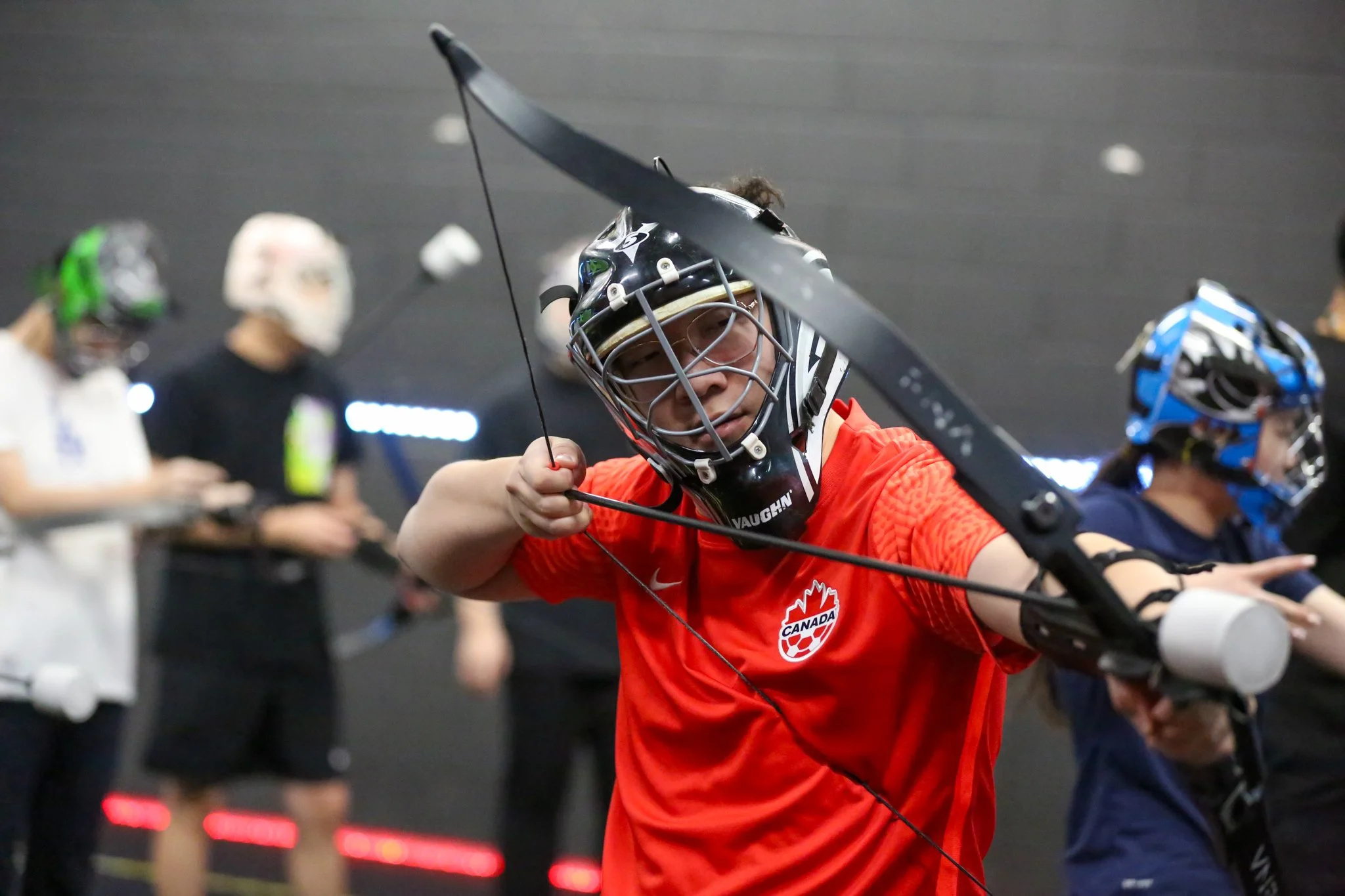 Adults playing Combat Archery during weekday games at Archers Arena Toronto